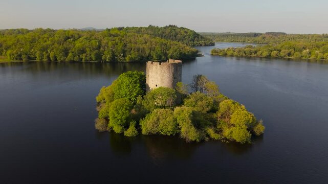Cloughoughter Castle stands as a majestic ruin on a small island in the calm waters of Lough Oughter, County Cavan, Ireland, surrounded by lush greenery