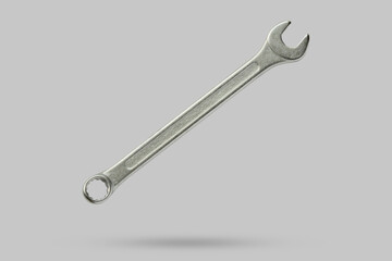 Wrench fly over gray background close up