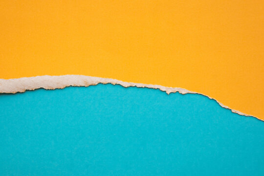 Yellow ripped paper torn edges strips isolated on blue background - Powered by Adobe