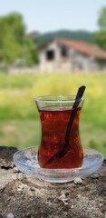 A glass of hot black tea