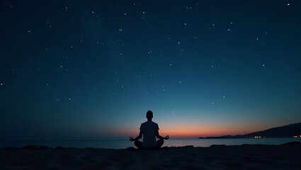 Silhouette of person meditating on beach under a starry night sky at dusk with orange horizon glow