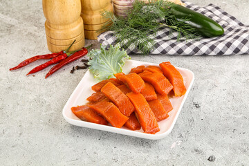 Red pickled herring fish fillet