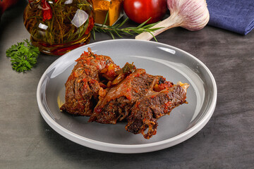 Baked beef ribs with vegetables