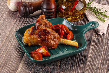 Baked lamb shank with vegetables
