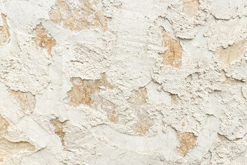 Textured Stucco Wall with Beige and White Patches