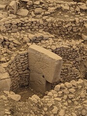 Ancient T-shaped carved stone pillar at Göbekli Tepe, the world’s oldest known temple site,...