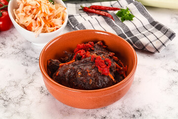 Baked beef cheeks with vegetables