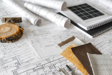 sustainable architecture tools and materials: blueprints, solar panel, wood textures, fabric...