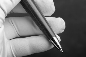 Branded pen with ink and nib in a box. Gift set. Office interior.