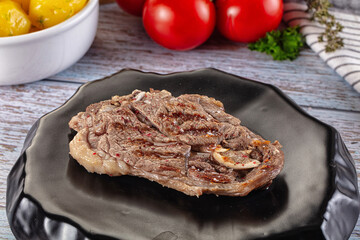 Grilled lamb steak with bone