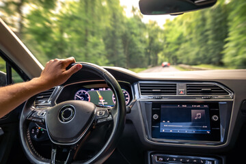 Car driving interior. Forest motion blur. Fast forward journey.
