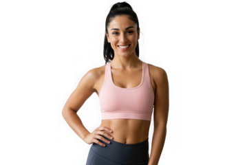 Woman smiles wearing a pink sports bra and gray leggings posing on transparent background