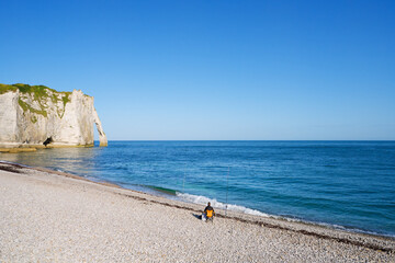 Fisherman on the pebble beach of Etretat  