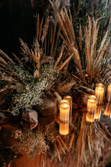 Elegance of candlelight and dried flower arrangements in a serene setting