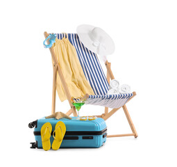 Striped deck chair, dress, suitcase and beach accessories isolated on white background