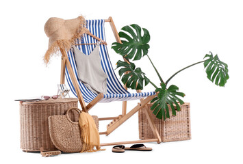 Striped deck chair, table, houseplant and beach accessories isolated on white background