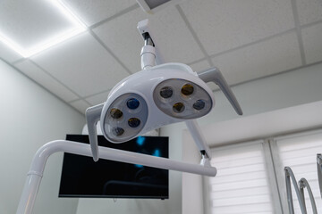 Modern dental lamp in dental clinic.