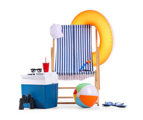 Refrigerator, striped deck chair, binoculars and beach accessories isolated on white background