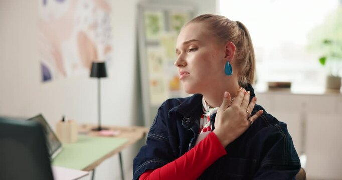 Woman, neck pain or injury at creative workplace for bad posture, inflammation or tension. Burnout, stiff or shoulder cramp with pressure, massage for relief or poor ergonomics at digital agency