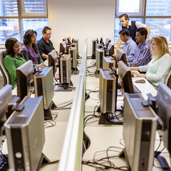 Adult Education: Computer Suite. Mature students at work in their college computer suite. From a...
