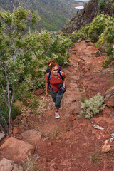 Hiker on volcanic trail in Tenerife