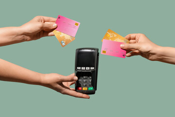 Female hands holding payment terminal and credit cards on light turquoise background