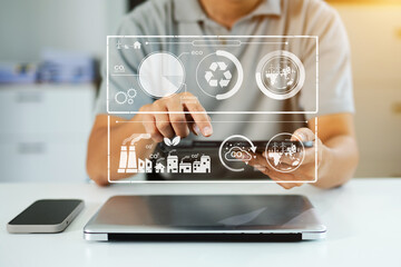 Business man working virtual modern smartphone to reduce CO2 emissions carbon footprint climate...
