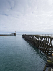 Entrance to Port of Blyth with piers and lighthouse, Northmberland, UK