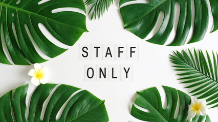 STAFF ONLY Text in Dynamic Minimalist Style – Realistic Typography with Green Tropical Floral Leaves