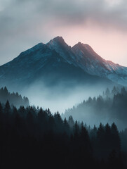 Explore majestic mountain silhouettes against a misty forest backdrop during the early morning light
