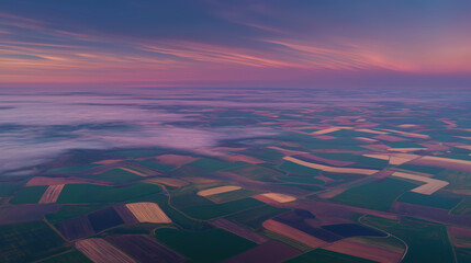 Aerial view of patchwork farmland in early spring