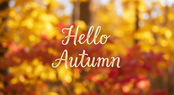 Hello autumn lettering on a blurred background with warm golden and red foliage. Seasonal greeting for festive decoration or banner.