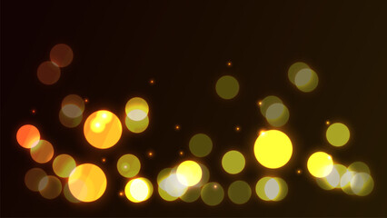 bstract glowing bokeh light background in warm tones of yellow, orange, and gold on a dark backdrop.
