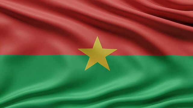 4K seamless loop footage of the Burkina Faso flag waving gently. Features vibrant red and green stripes with a central yellow star, symbolizing national identity and unity. Ideal for patriotic content