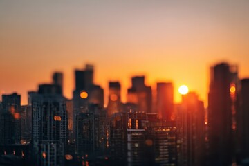 Fototapeta premium Blurred city skyline at sunset