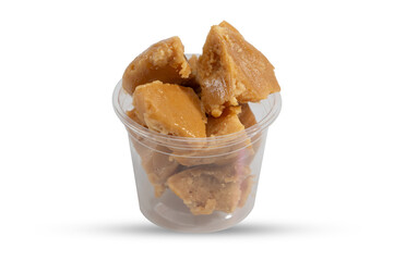 Chunks of Palm Sugar in Clear Plastic Cup