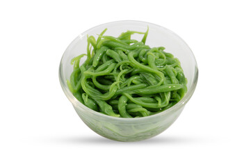 Close-up of green cendol jelly in a clear bowl, commonly used in Southeast Asian desserts, isolated on white background