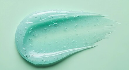 A translucent teal gel swatch with small air bubbles, smoothly spread on a pale green background.