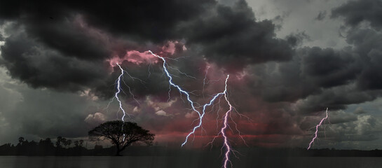 Lightning bolts illuminate the stormy night sky, approaching the viewer. terrifying Cloudy, Clodus...