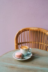 Photograph of an espresso and macaron on the table