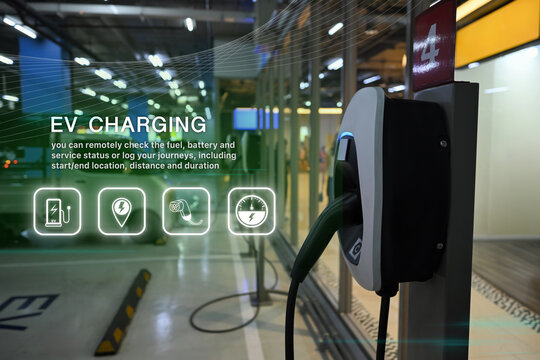 Smart electric vehicle charging station in a modern parking area with digital interface and green energy icons