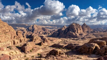 Arid landscape unveils rock formations under cumulus sky