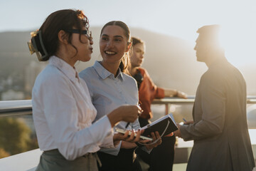 A diverse group of business people engage in a brainstorming session on a high balcony, emphasizing...