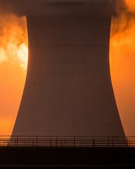 Cooling tower at a power plant at sunrise