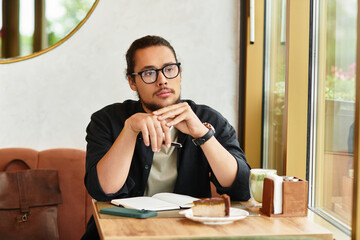 Young freelancer enjoying matcha and cake while working remotely in vibrant cafe setting