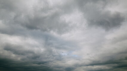 Dramatic Overcast Sky Filled with Rolling Clouds, Conveying a Unique Atmosphere and Mood