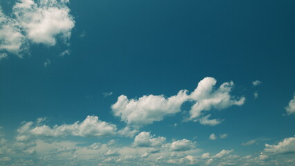 Time lapse. A Beautiful Cloudy Sky Accompanied by a Vibrant and Rich Blue Background Appears