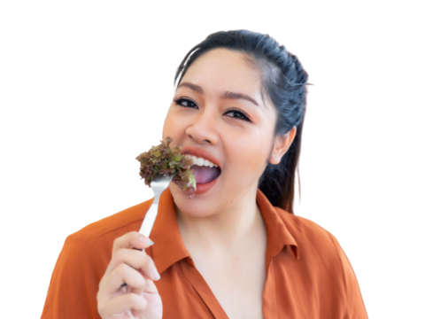 Happy Asian woman enthusiastically eating fresh healthy salad with a fork, promoting wholesome nutrition, healthy lifestyle, diet, and vegetarian food choices , isolated on a transparent background