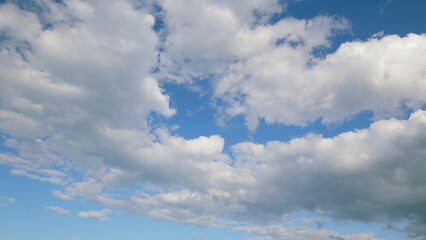 A Beautiful Cloudy Sky with a Stunning Blue Background that captivates the observers gaze
