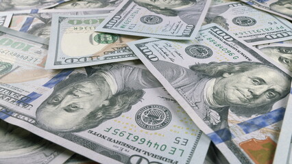 A CloseUp of American Dollar Bills Spread Out on a Surface for Detailed Viewing and Analysis